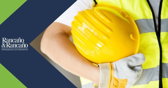 worker holding a hard hat